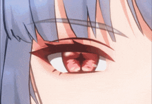 a close up of a girl 's red eye with a white pupil
