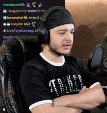 a man wearing headphones is sitting in a chair