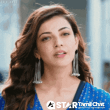 a close up of a woman with a star tamil chat logo
