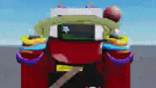 a red tractor with a rainbow of cupcakes on the back is driving down a road in a video game .