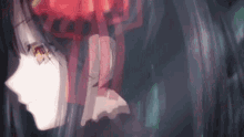 a close up of a person 's face in a dark room with a blurred background .