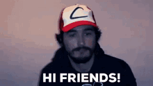 a man with a beard wearing a hat with the letter c on it says hi friends .
