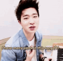 a young man is playing a piano and saying " i have many parts in this song ( a ) "
