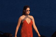 a woman in a very plunging red dress