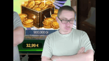 a man with his arms crossed in front of a screen that says 32.99