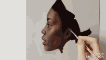 a person is painting a woman 's face with a brush ..