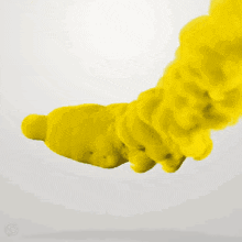 blue and yellow smoke is coming out of a bottle