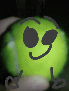 a drawing of a green ball with a smiling face