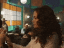 a blurry picture of a woman with the letter l visible