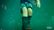 a poster for elio shows a boy swimming in the water