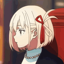 a girl with a red bow in her hair