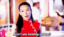 a woman in a red top says aren 't you heading out too ?