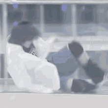 a blurry picture of a person jumping in the air .
