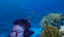 a man wearing a black adidas shirt is swimming in the ocean