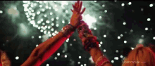 a blurred image of a woman 's hands with the website insomniac.com in the corner