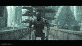 a robot is walking across a bridge in a city .