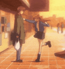 a man and a woman are standing on a tiled sidewalk