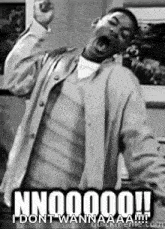 a black and white photo of a man with his mouth open and the caption nn00000 i dont wannaaa