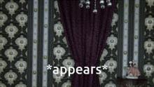 a room with a purple curtain and the word appears on the bottom right