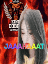 a girl with a king cobra logo in the background