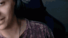 a close up of a person 's face with headphones on .