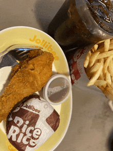 a jollibee fried chicken meal with rice rice and french fries