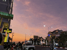 a busy street with a sign that says sim long hotel