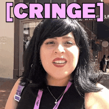 a woman wearing a lanyard that says logitech