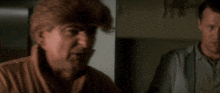 a man says " it 's a mystery " in front of another man