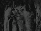 a black and white photo of a person 's torso