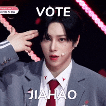 a man in a suit and tie with the words vote jiahao on his face