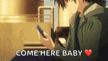 a man is holding a cell phone and the words come here baby are above him .