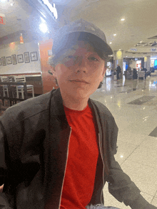 a boy wearing a hat that says north face