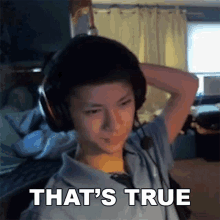 a young boy wearing headphones says that 's true .