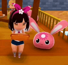 a girl in a pink headband is standing next to a pink bunny .
