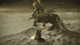 a man riding on the back of a horse in a desert