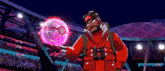 a man in a red jacket is holding a pokeball in his hand .