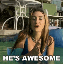 a woman sitting in a pool with the words he 's awesome on the bottom