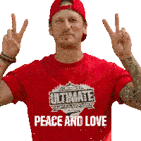 a man is wearing a red shirt that says ultimate challenge peace and love