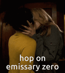 a couple kissing with the words hop on emissary zero behind them