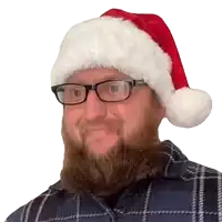 a man with a beard wearing a santa hat