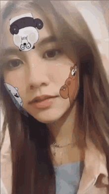 a woman with a panda bear on her forehead