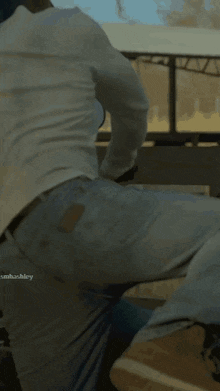 a man 's butt is shown in a blurry photo with the name sashaashley visible