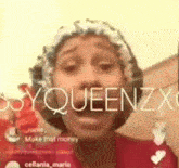 a woman is wearing a shower cap and talking on a video call .