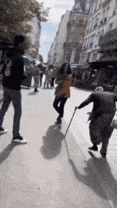 a man and a woman are walking down a street