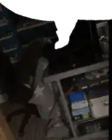 a person sitting in a chair in front of a shelf that says armor msi