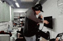 a man singing into a microphone in a room