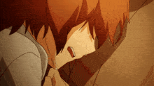a boy with red hair is crying while laying on a couch .