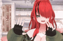 a girl with red hair is wearing gloves and a green jacket