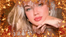 a woman 's face is surrounded by flames and the word agatha is visible